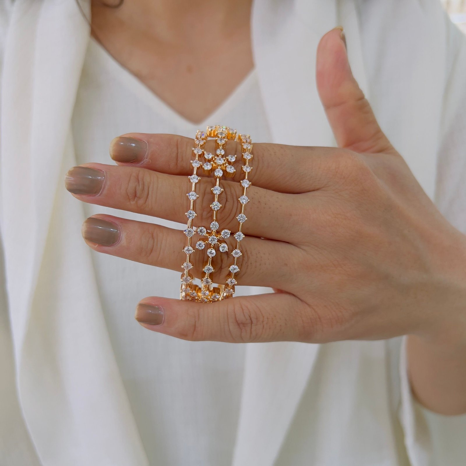 Exquisitely handcrafted designer bangles, finished in rich 18-carat gold plating for a timeless, luxurious look.” - Image 2